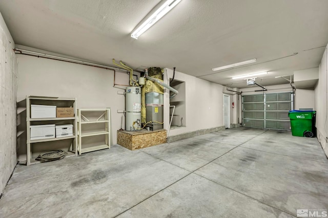 garage featuring water heater and a garage door opener