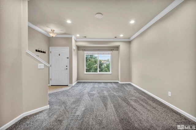 interior space with light colored carpet and crown molding