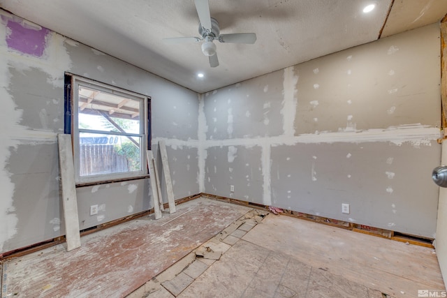 unfurnished room with ceiling fan