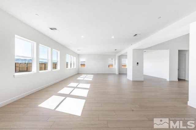 unfurnished room with light wood-type flooring