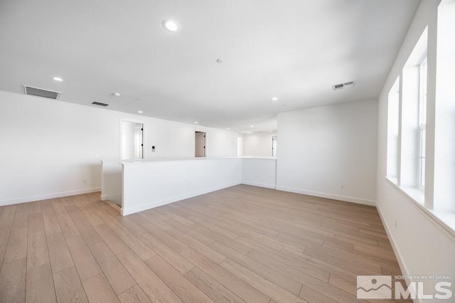 empty room with light hardwood / wood-style floors