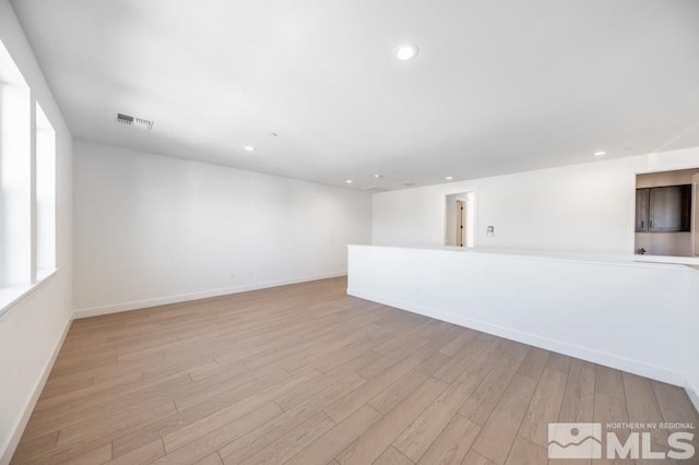 unfurnished room with light hardwood / wood-style flooring