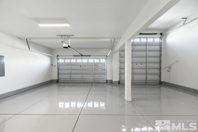 garage featuring a garage door opener and electric panel