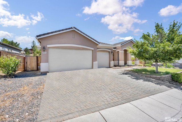 ranch-style home featuring a garage