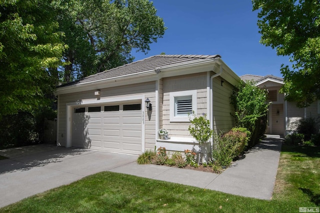 view of side of property featuring a garage