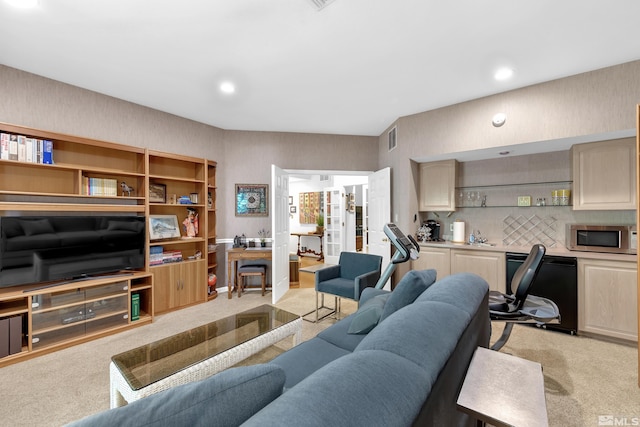 carpeted living room featuring sink