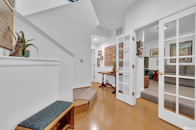 interior space with hardwood / wood-style floors and french doors