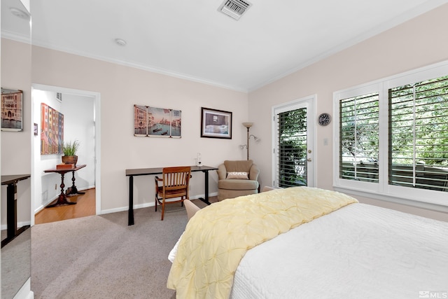 carpeted bedroom featuring ornamental molding and access to outside