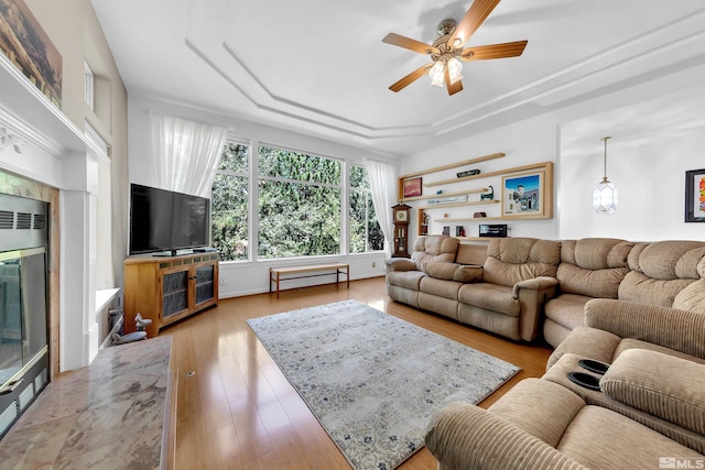 living room featuring ceiling fan and light wood-type flooring