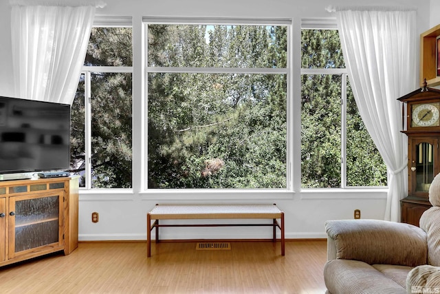 living area featuring plenty of natural light and light wood-type flooring