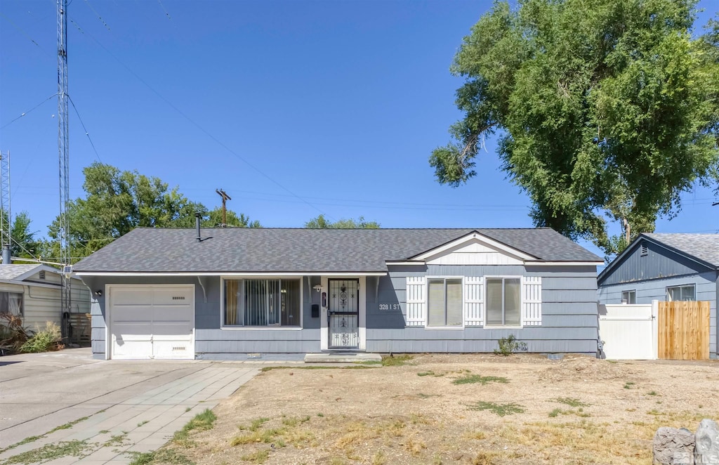 ranch-style home with a garage and covered porch