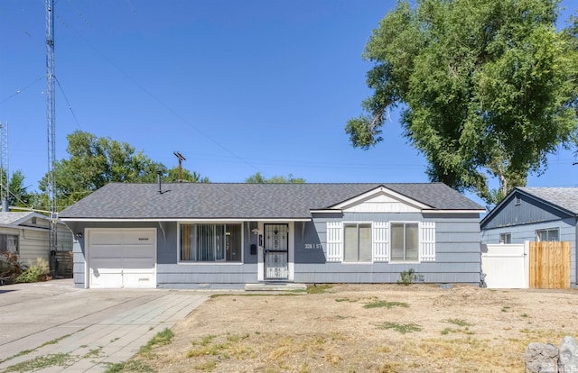 ranch-style home with a garage and covered porch