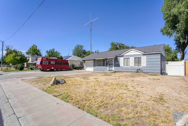 ranch-style home featuring a front yard