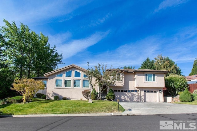 view of front facade featuring a front yard and a garage