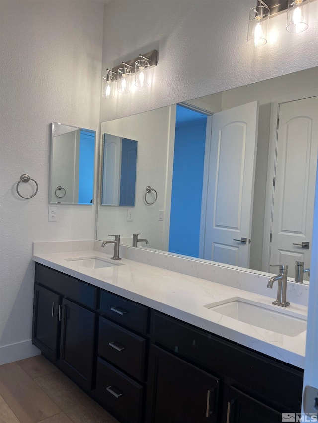 bathroom featuring vanity and wood-type flooring