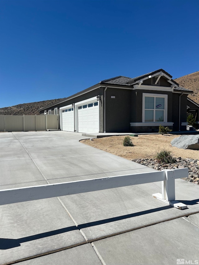 view of front of property with a garage