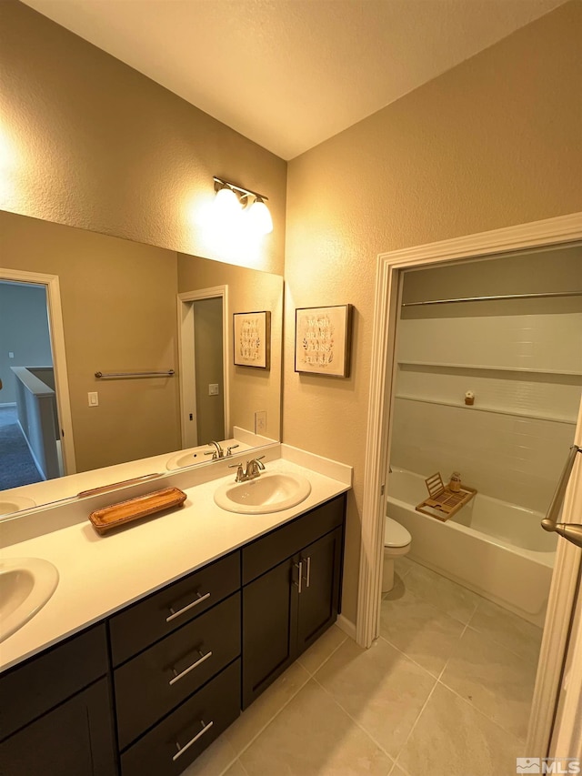 bathroom with vanity, toilet, and tile patterned floors