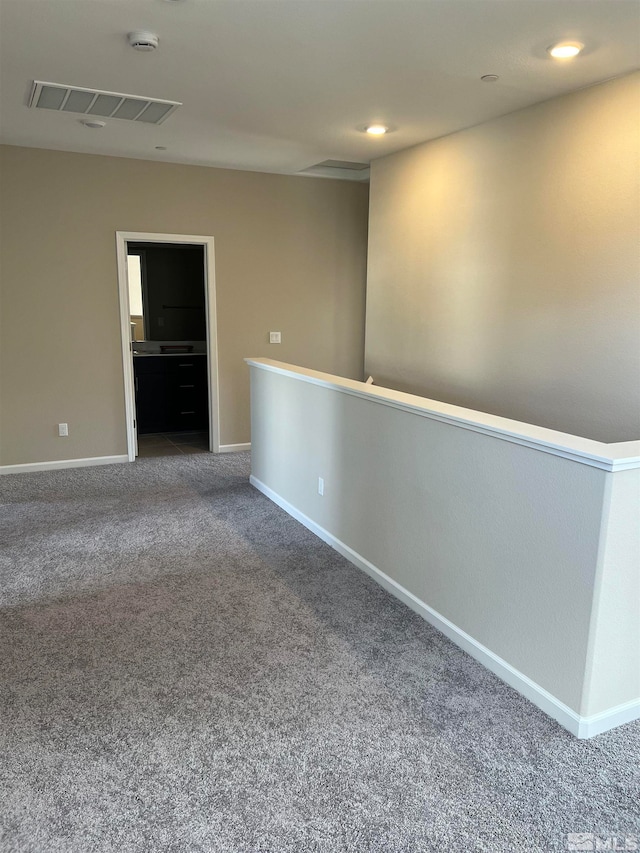 empty room with carpet flooring