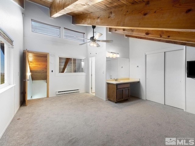 unfurnished living room featuring wooden ceiling, a baseboard radiator, ceiling fan, and light colored carpet