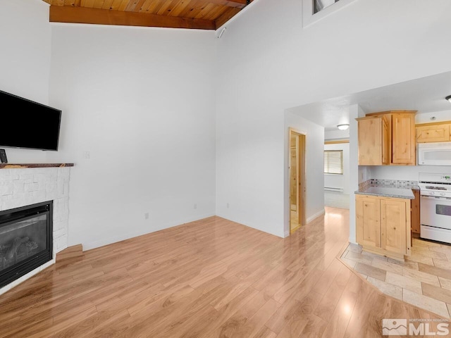 living room with a fireplace, high vaulted ceiling, baseboard heating, wood ceiling, and light hardwood / wood-style floors