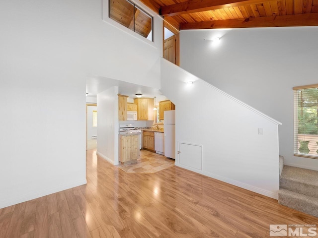 unfurnished living room featuring beamed ceiling, wooden ceiling, sink, high vaulted ceiling, and light wood-type flooring