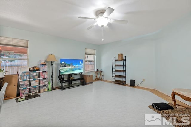 interior space featuring ceiling fan