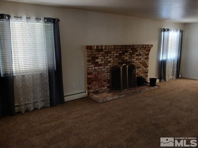 unfurnished living room featuring a fireplace, a baseboard heating unit, and carpet