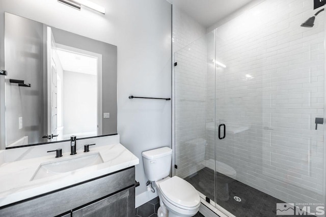 bathroom featuring walk in shower, toilet, and vanity