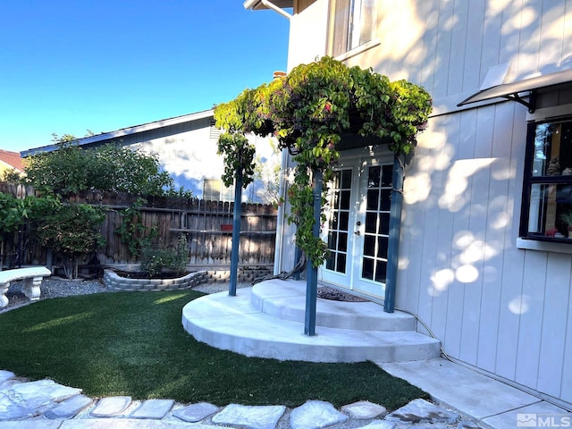 view of yard with french doors