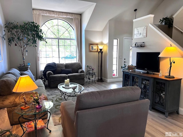 living room with light hardwood / wood-style flooring