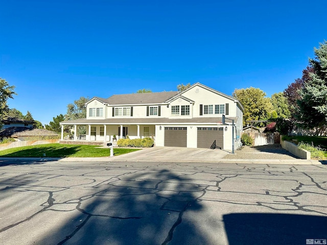 view of front of house featuring a garage and a front yard