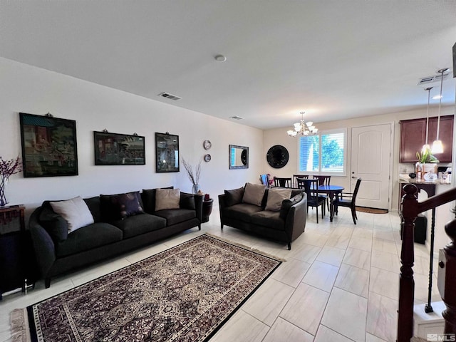 living room with a notable chandelier