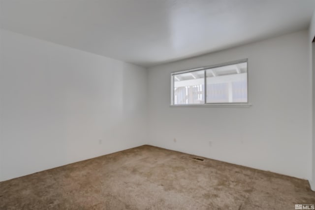 empty room with light colored carpet