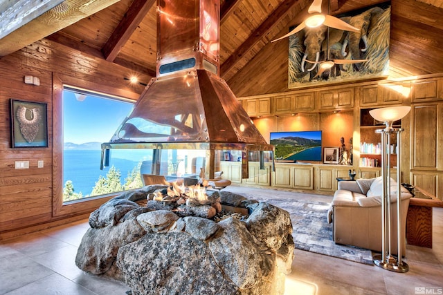 living room featuring wood ceiling, wooden walls, ceiling fan, and beamed ceiling