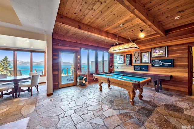 recreation room featuring beamed ceiling, billiards, wooden walls, and a water view