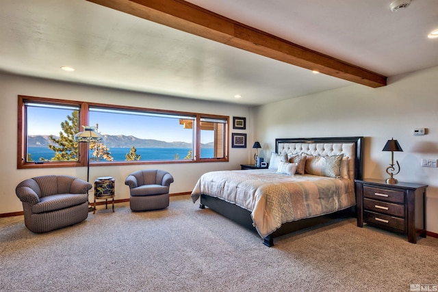 carpeted bedroom featuring beamed ceiling, a water and mountain view, and multiple windows