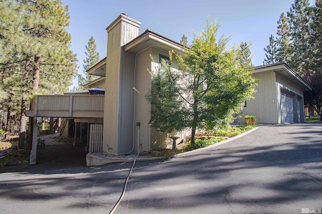 view of side of home featuring a wooden deck