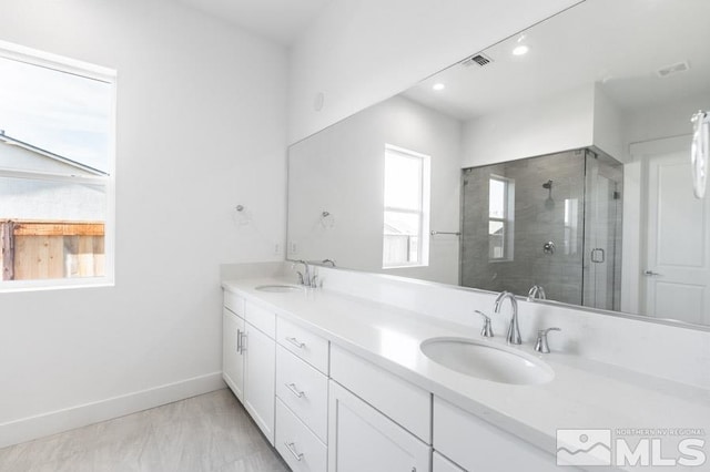 bathroom with vanity and walk in shower