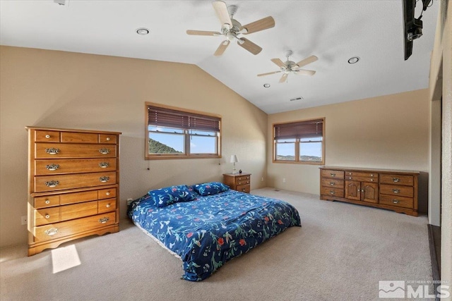 carpeted bedroom featuring lofted ceiling and ceiling fan