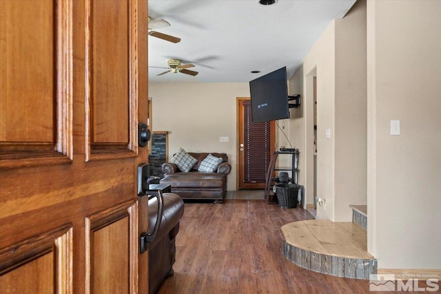 interior space featuring dark hardwood / wood-style flooring and ceiling fan