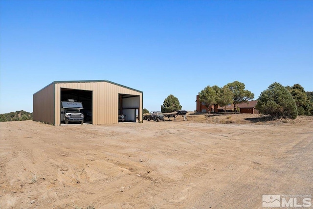 view of outbuilding featuring a garage