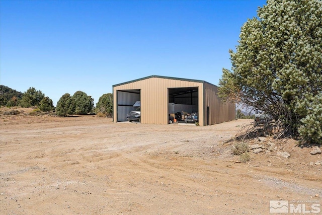 view of outdoor structure with a garage