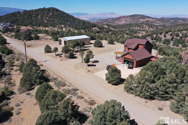 birds eye view of property featuring a mountain view