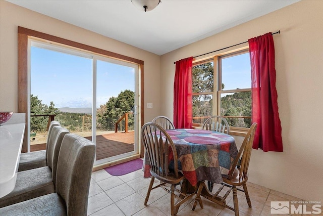 dining room featuring light tile patterned flooring