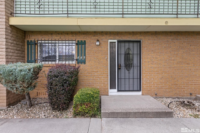 doorway to property featuring a balcony