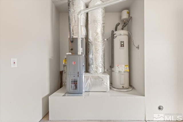 utility room featuring electric water heater