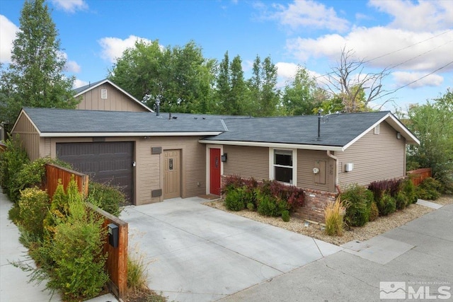 ranch-style home featuring a garage