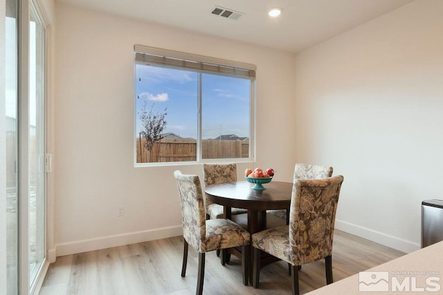 dining room featuring light hardwood / wood-style flooring