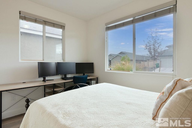 bedroom with hardwood / wood-style flooring