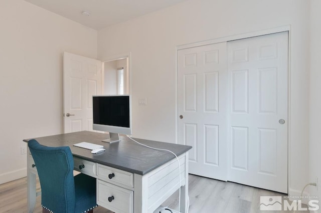 home office featuring light hardwood / wood-style flooring